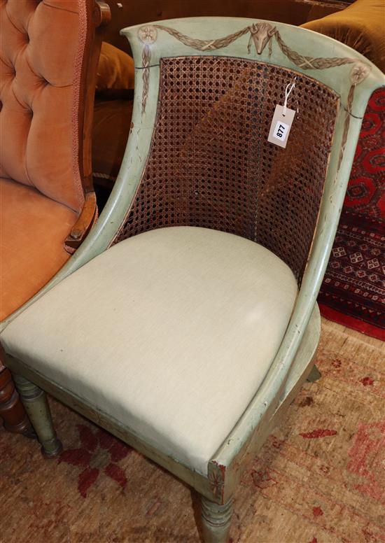 A Regency painted and decorated caned back bergere chair